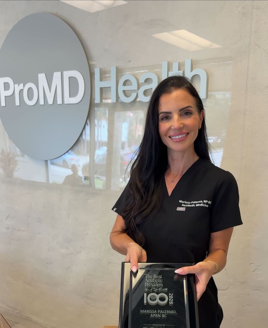 Marissa Palermo, APRN holding the Top 100 Aesthetic Provider 2026 award at ProMD Health Fort Lauderdale